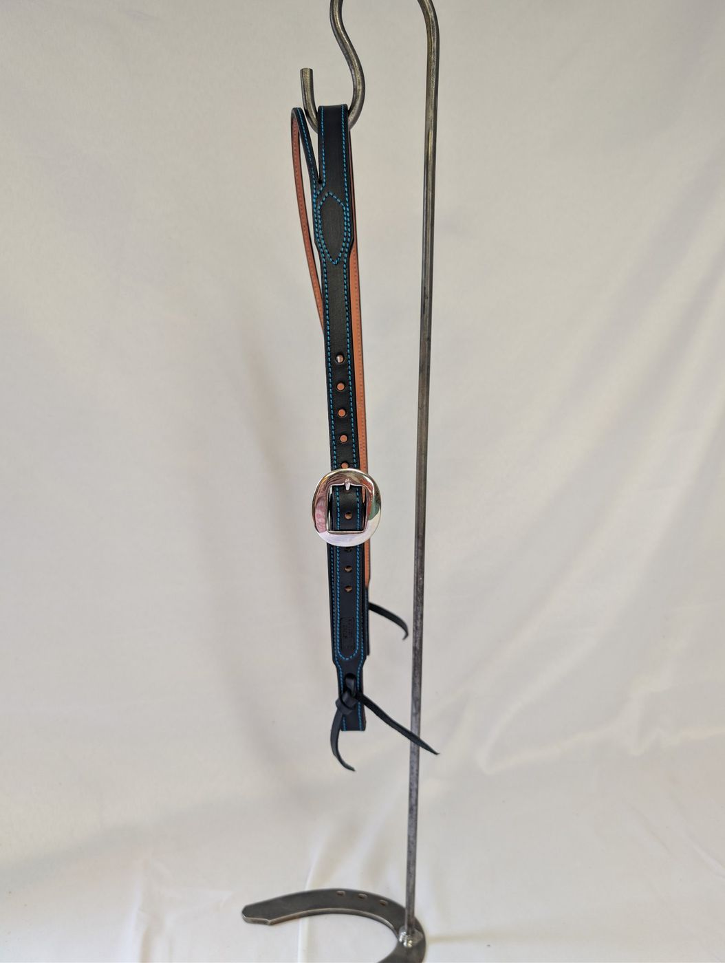 Black leather headstall with turquoise stitching, front view