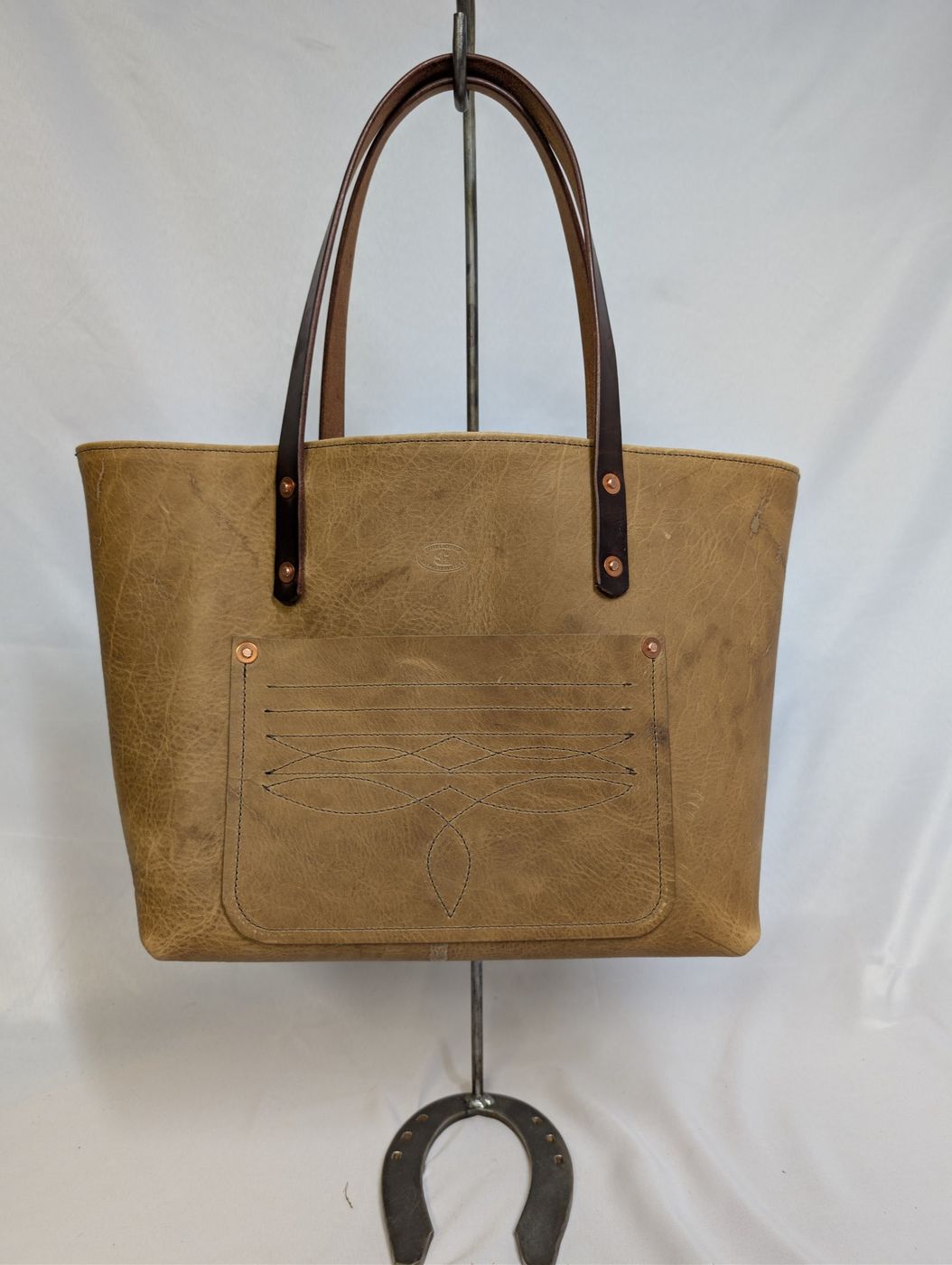 Tan leather tote with maker's mark
