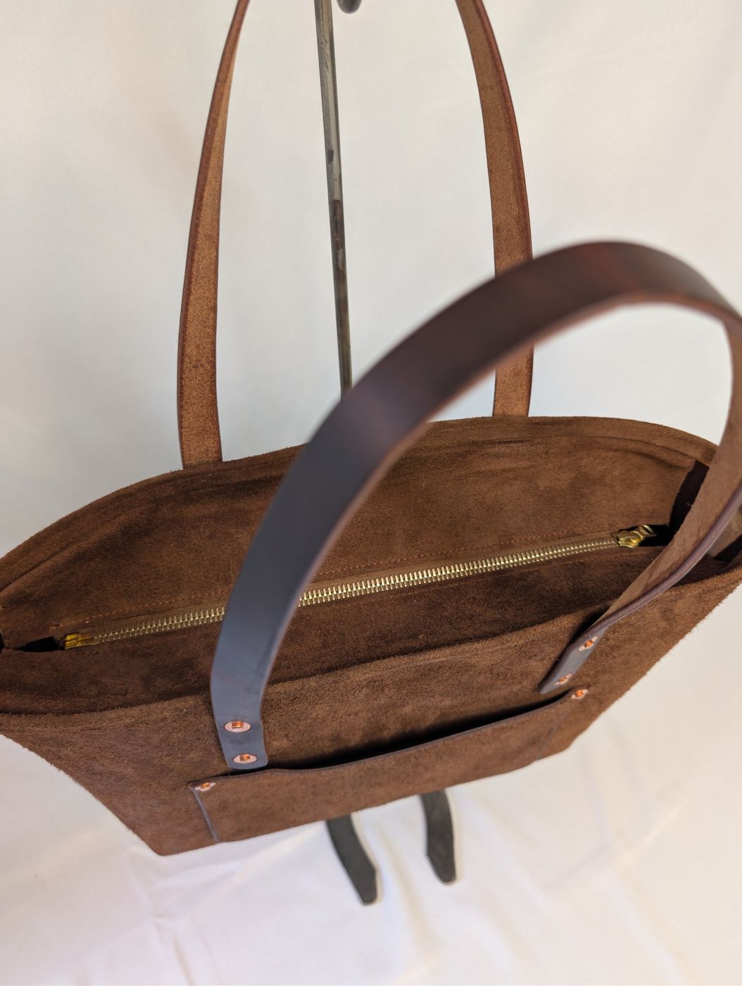 Brown suede zipper tote, brass zipper top detail