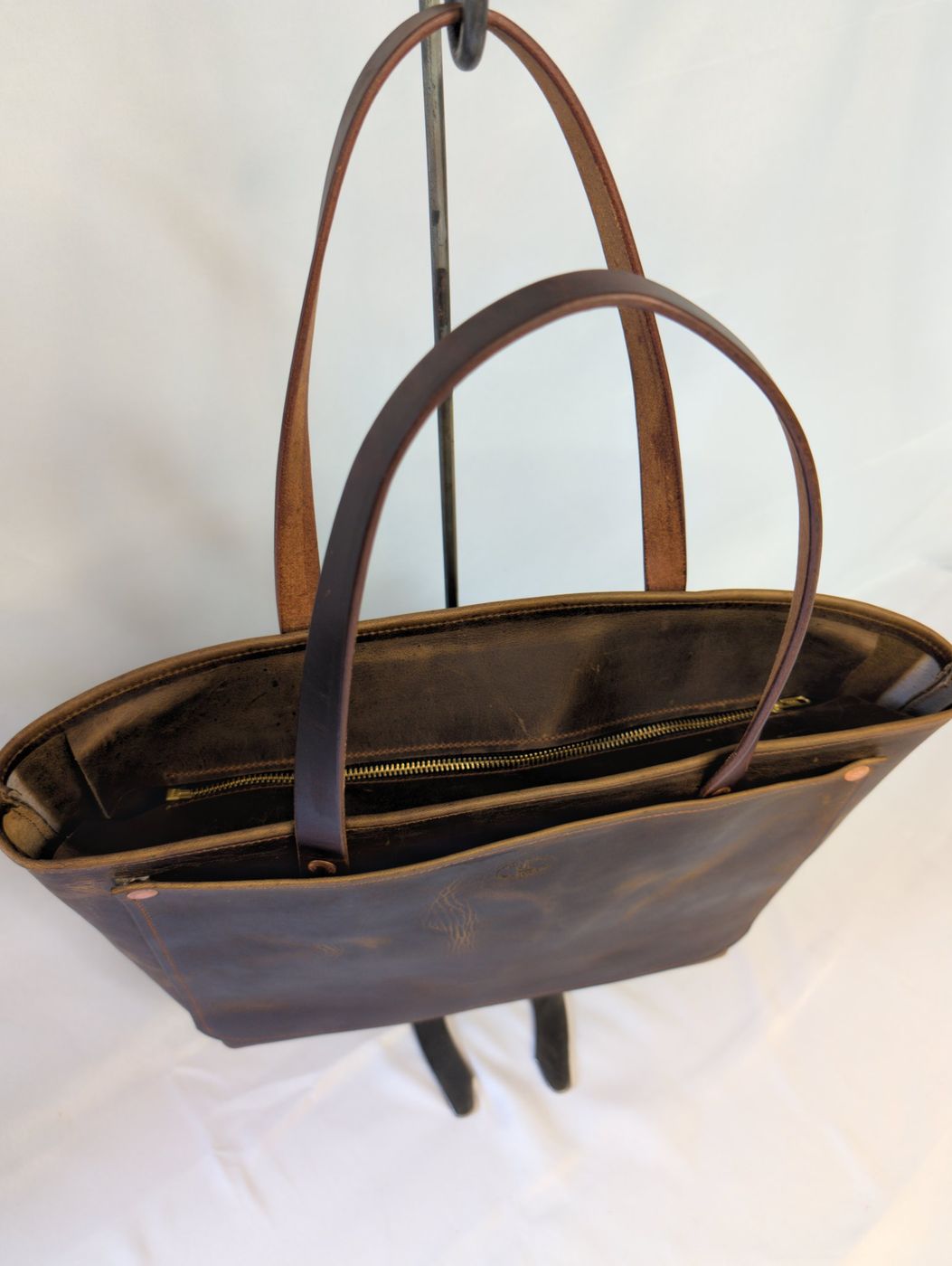 Dark brown distressed zipper tote, brass zipper top detail